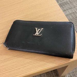 Authentic Louis Vuitton wallet. Black and silver.